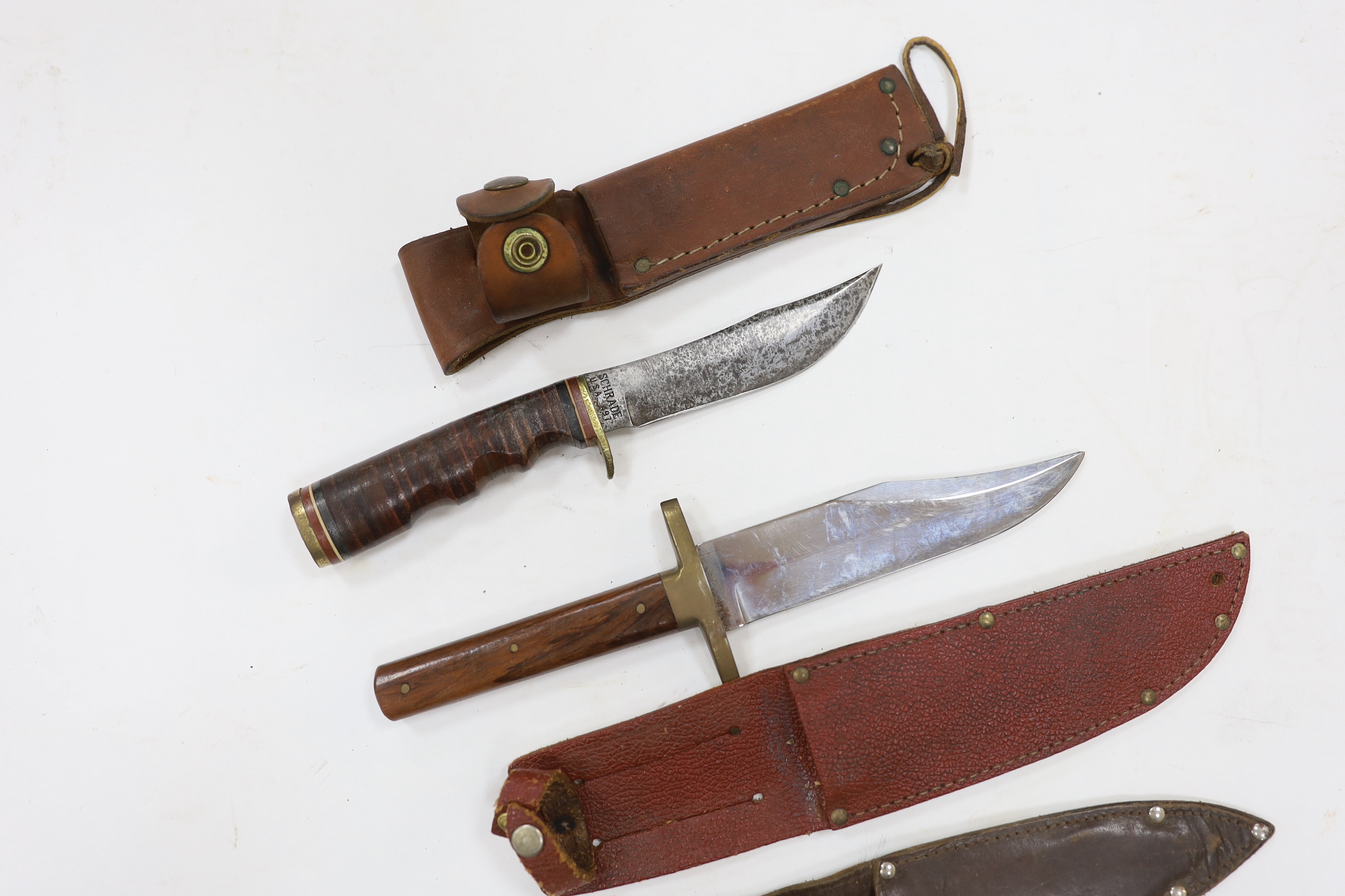 A continental cavalry trooper’s sword c.1780, together with a Legitimus Parang dated 1940 and four other assorted hunting knives